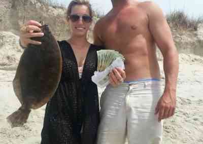 a fisherman with a flounder