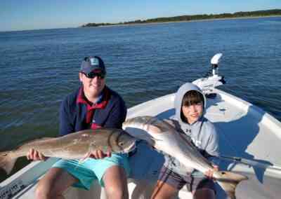 anglers with redfish