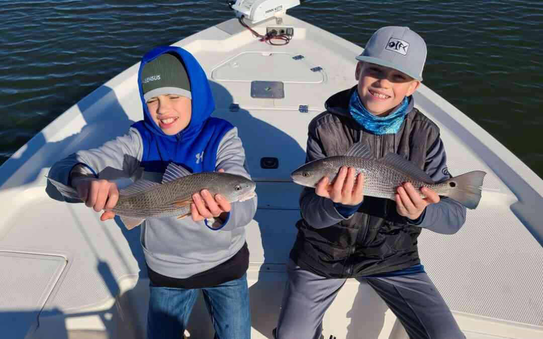 two Georgetown, South Carolina anglers with redfish