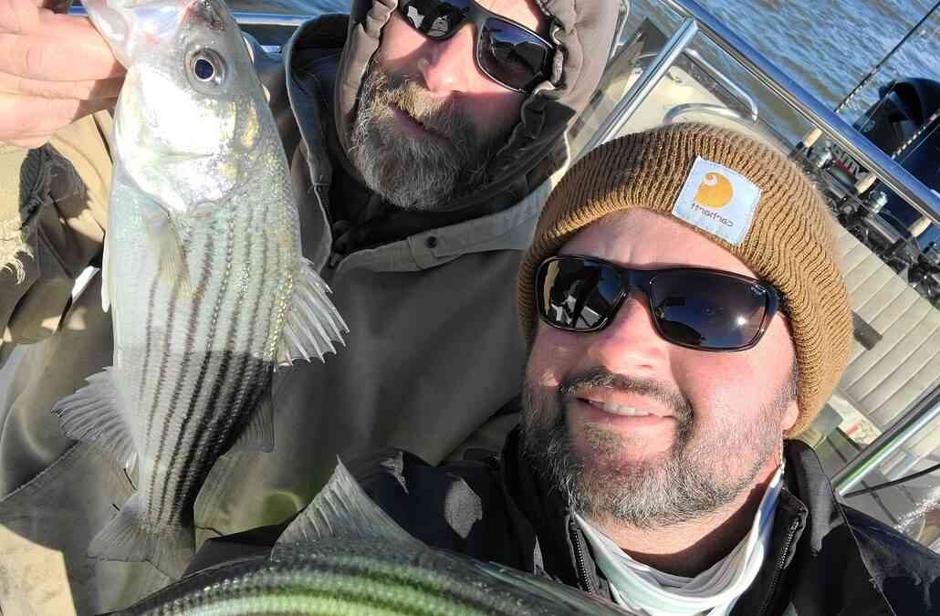 fishermen with striped bass