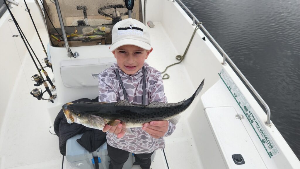 kid with sea trout