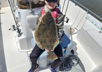 boy holding huge flounder