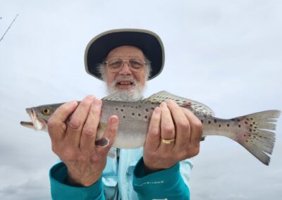 man with speckled trout