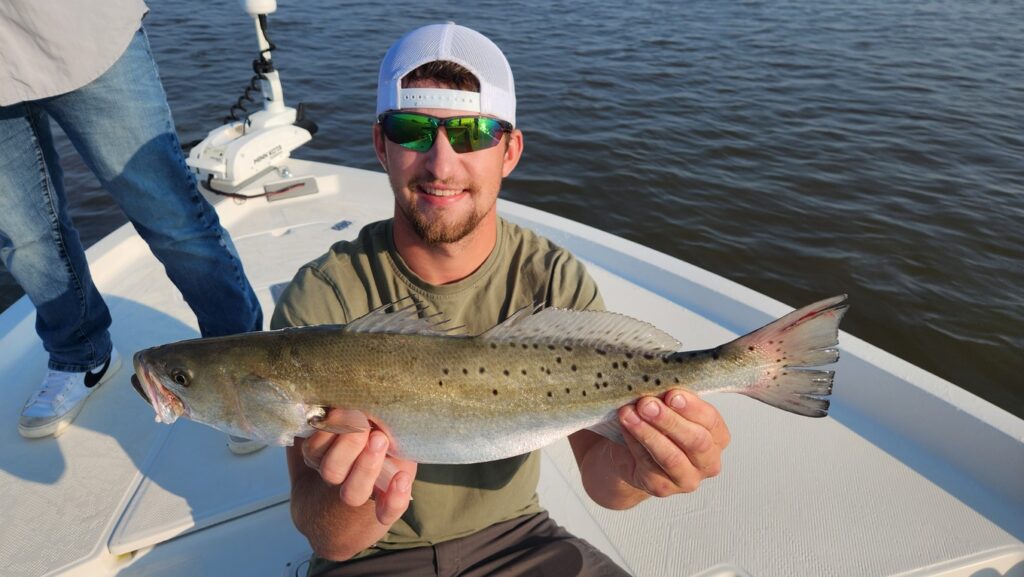 fisherman with speckled trout