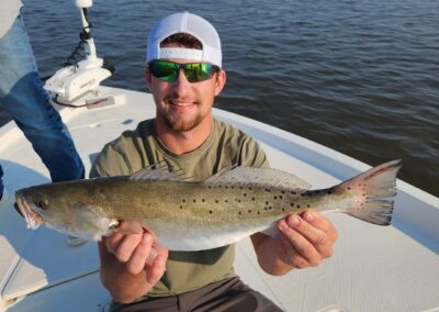 fisherman with pawleys island speckled trout