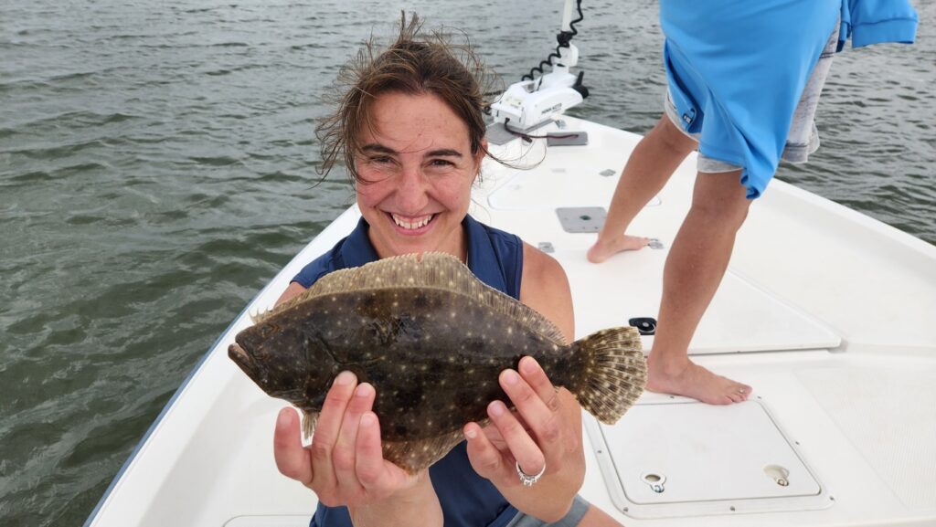 lady holding flounder in north myrtle beach