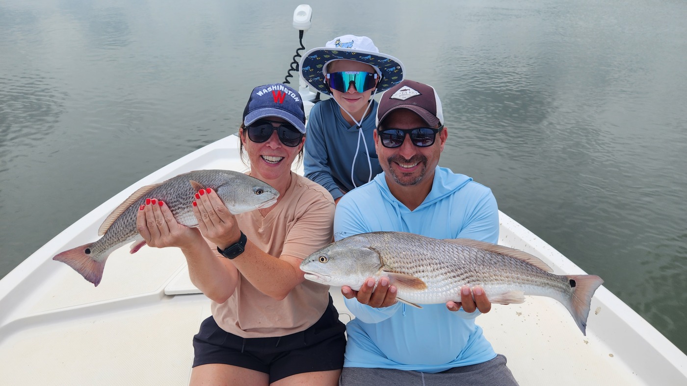 family photo with two redfish