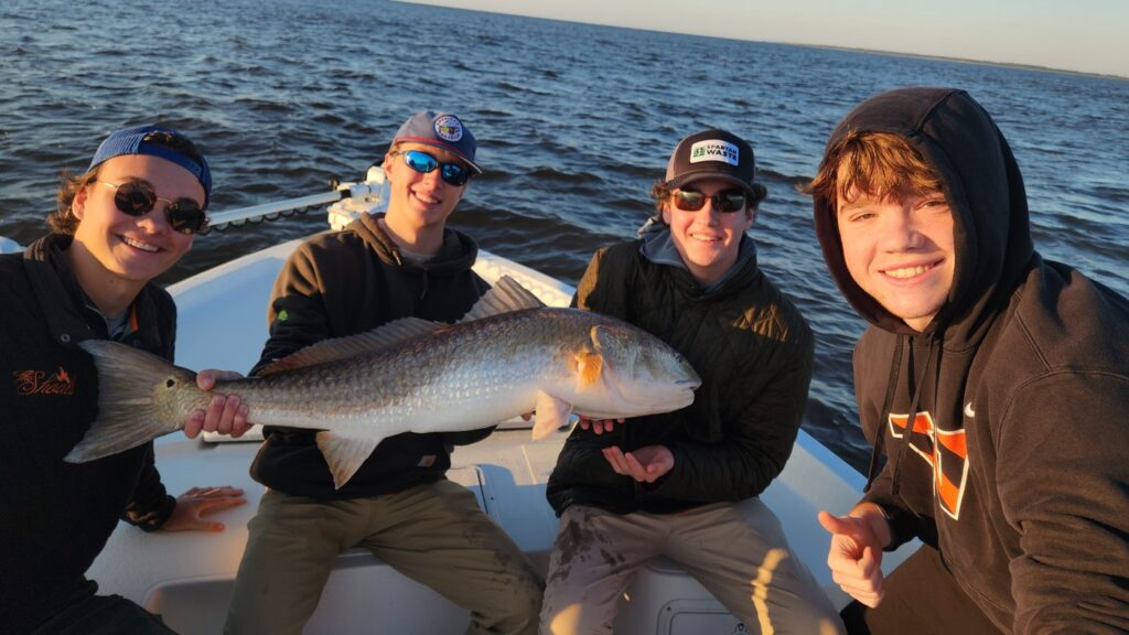 4 guys and a huge bull redfish off of myrtle beach