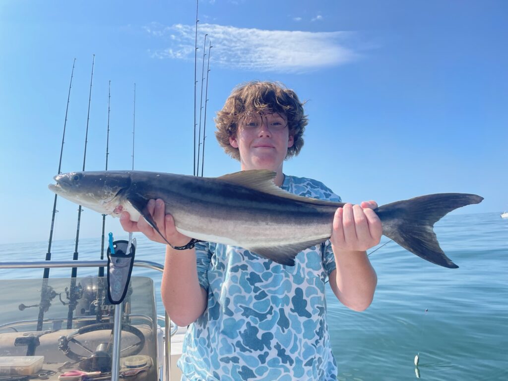 boy holding cobia off of myrtle beach, sc